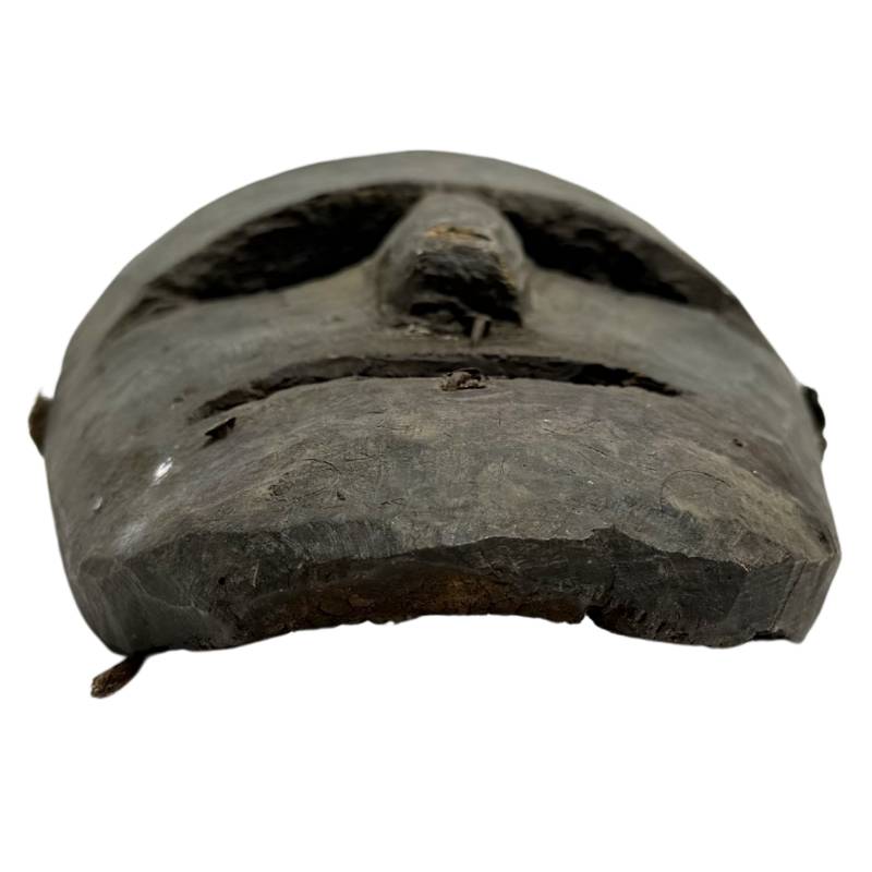 Hand-carved Himalayan wooden mask from Nepal with powerful expression