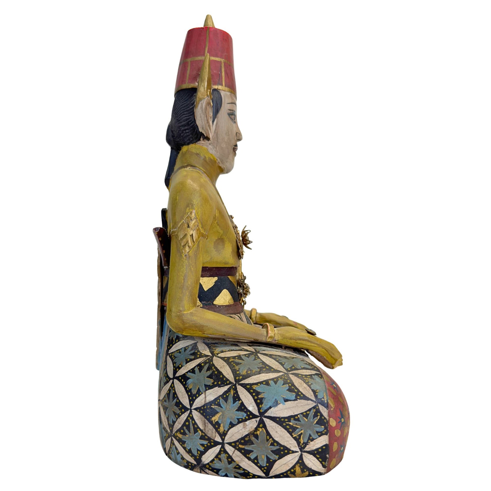 Detail of the polychrome painting on the Javanese wooden statues.