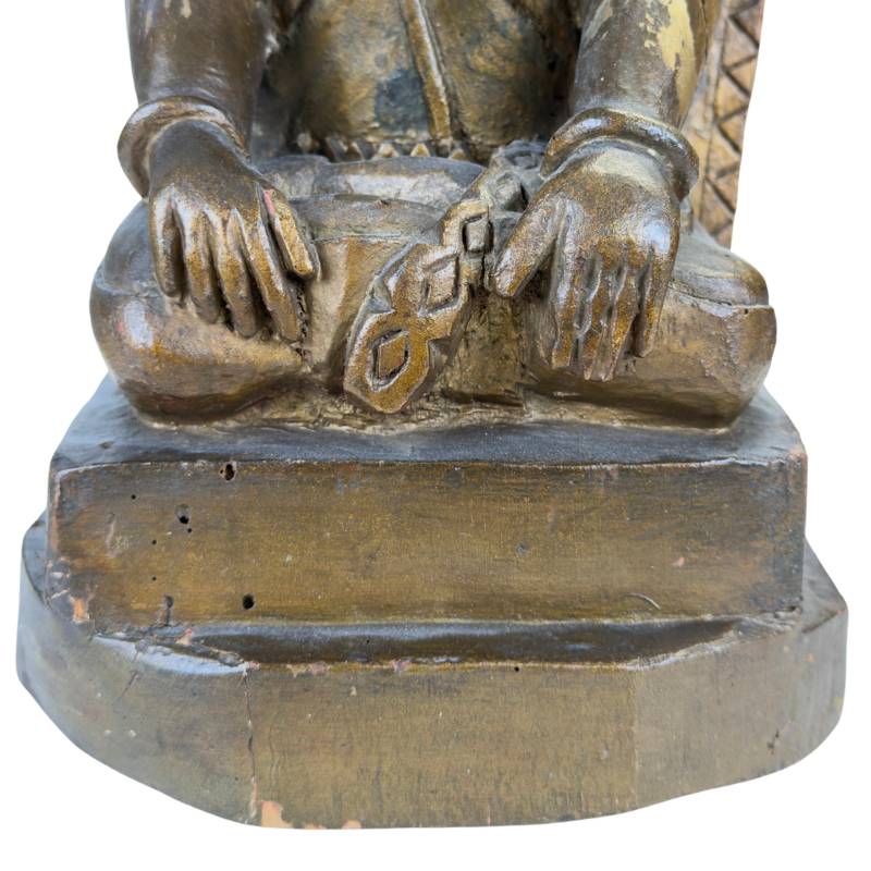 Hand-carved wooden Sri Devi figure with niche-shaped backplate