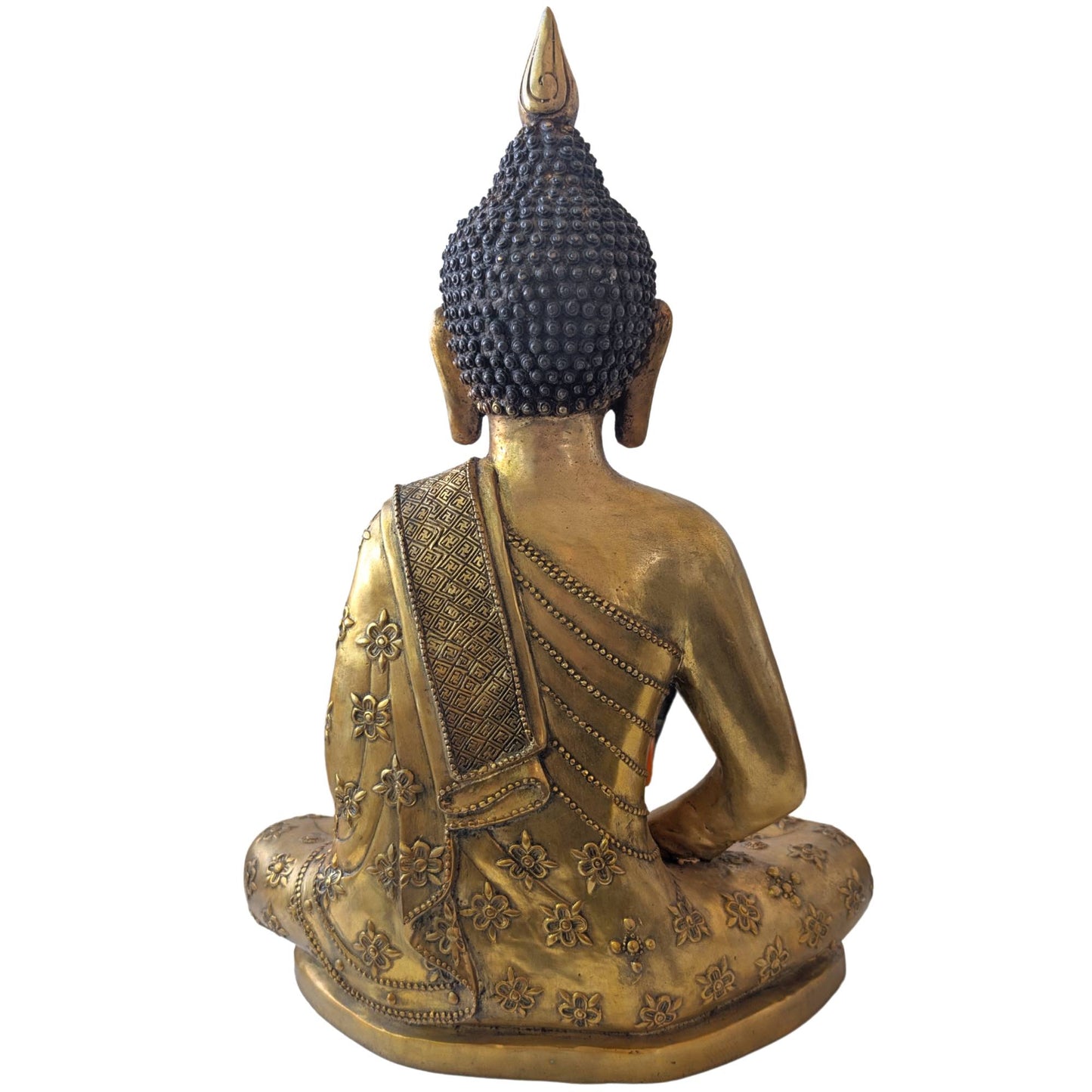 Manually refined floral decorations in high relief on a heavy Tibetan Buddha statue.