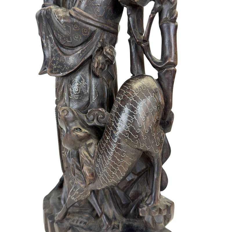 Chinese statue. Detail of the deep oxidation and natural patina on 19th-century Chinese hardwood.