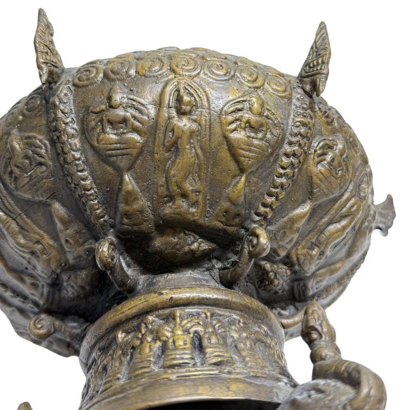 Holy Buddha amulet inlaid in the base of a Thai reliquary
