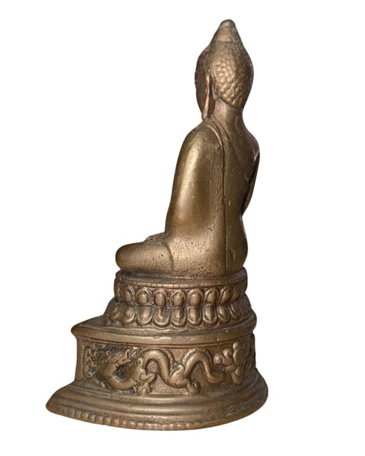 Bronze Himalayan Buddha statue with dragon motif and decorative base
