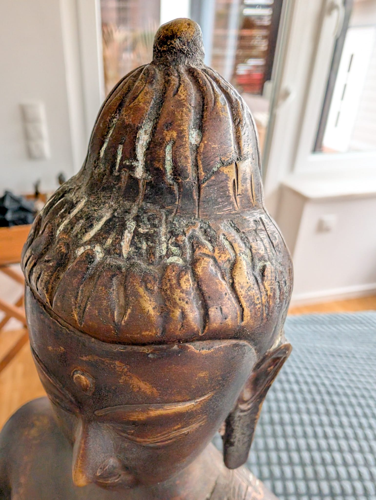 Himalayan bronze Buddha with a combination of gilding and patina