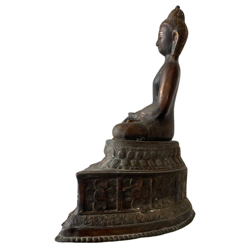 Himalayan bronze Buddha face with softened details, old patina and remnants of gilding in dhyana mudra