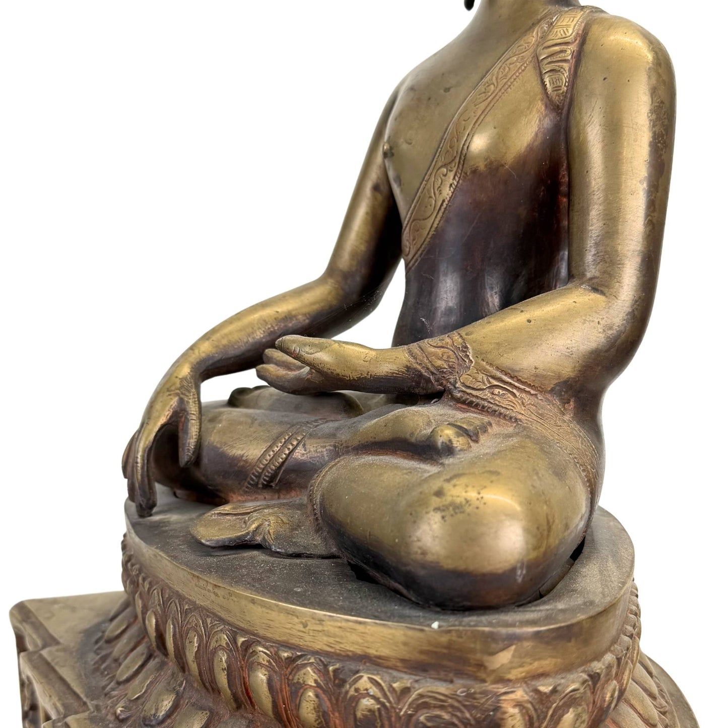 Detail of an old Himalayan Buddha with weathered silver eyes and a powerful meditative aura