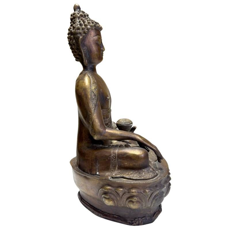 Antique Himalayan bronze Buddha statue in a seated position