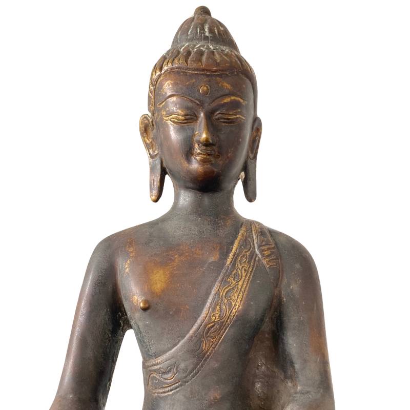 Himalayan bronze Buddha with remnants of fire gilding and wear