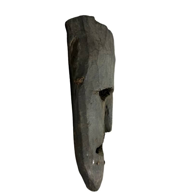 Wooden ritual mask from Nepal with dark natural patina

