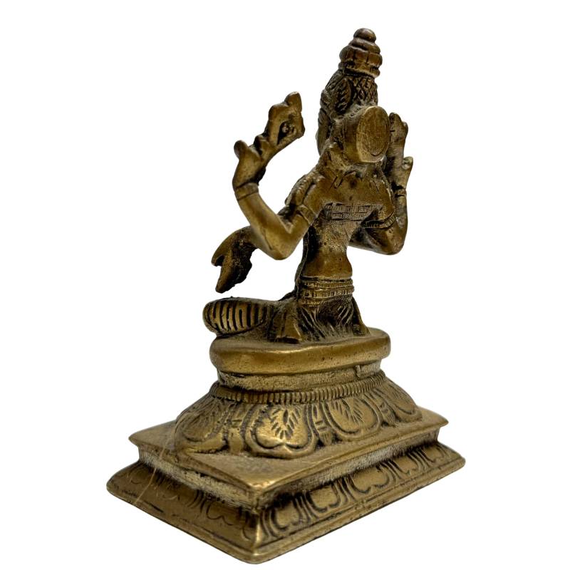 Bronze statue of Lakshmi with lotus flowers in her hands
