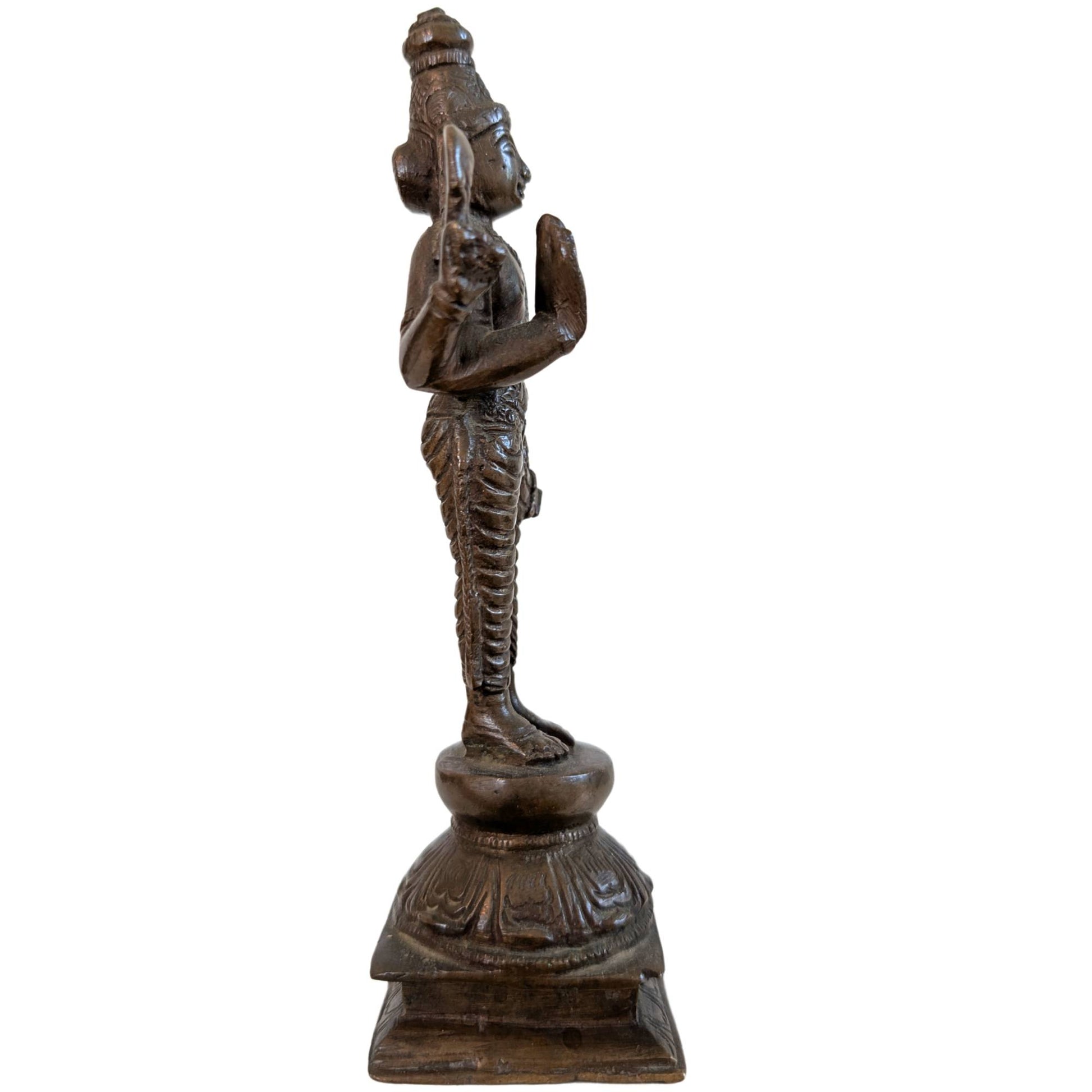 Detail of the dark patina on an antique Indian Vishnu statue.