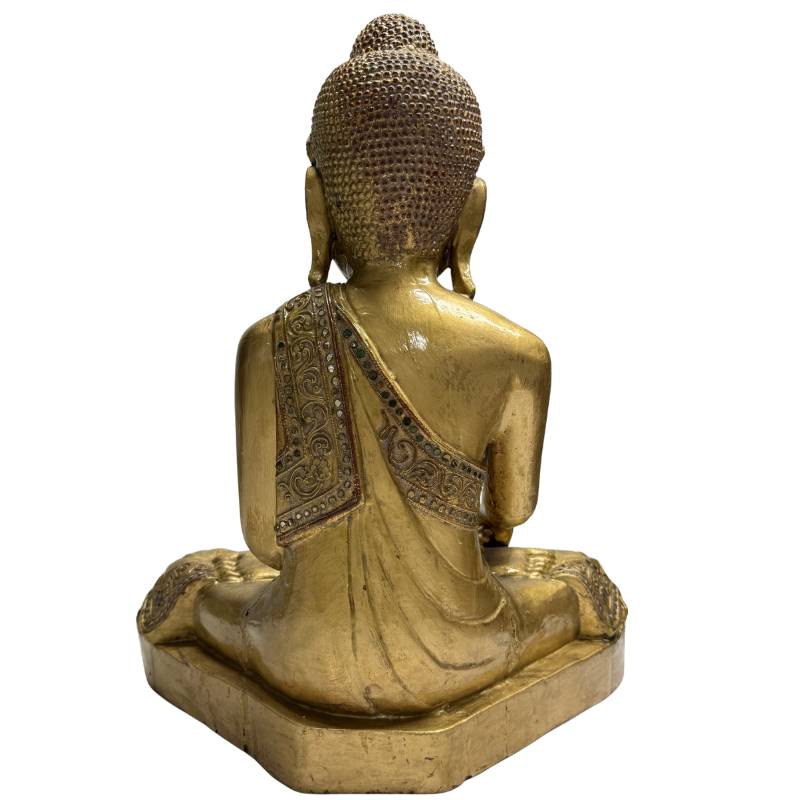 Wooden Buddha statue with detailed robe and glass inlay
