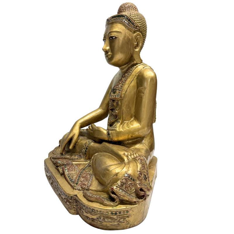 Wooden Buddha statue with visible carving
