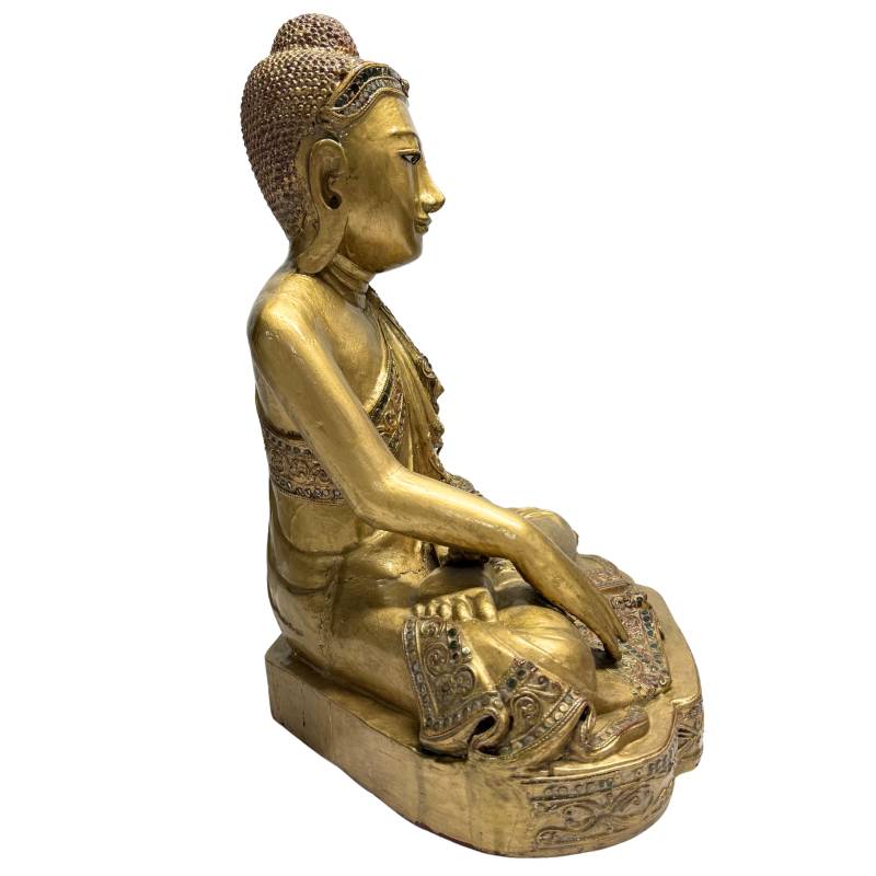 Wooden Buddha statue with glass inlay and decorative details
