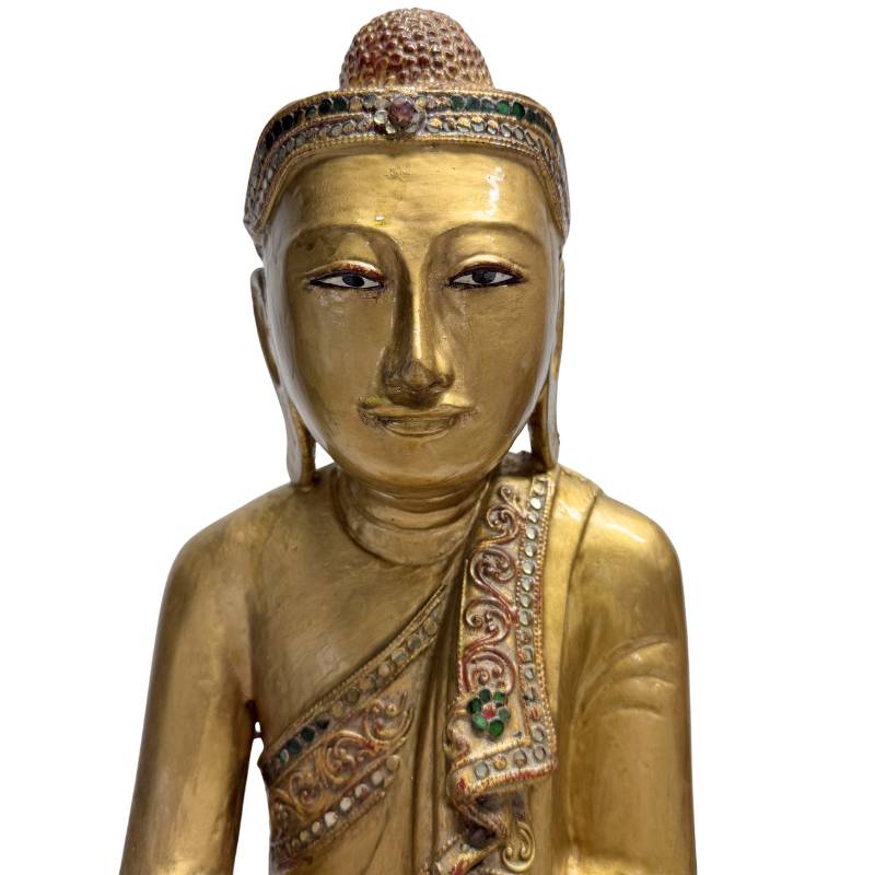 wooden Buddha statue with glass inlay and gilded details
