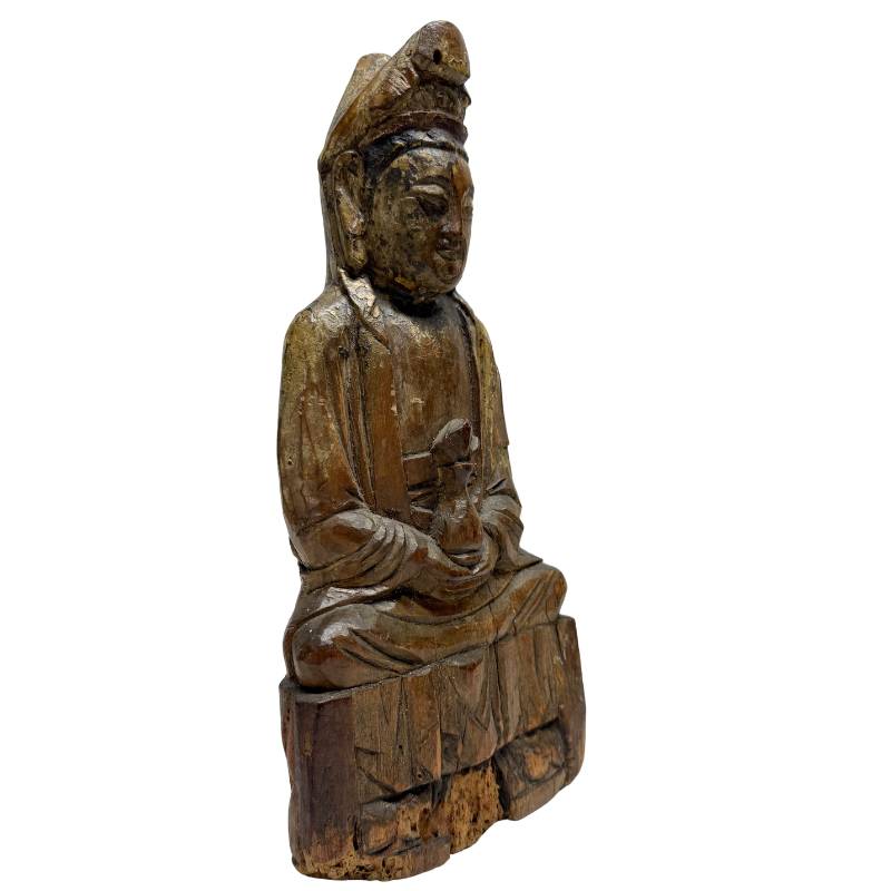 Old Chinese wooden Guanyin statue with visible age and character