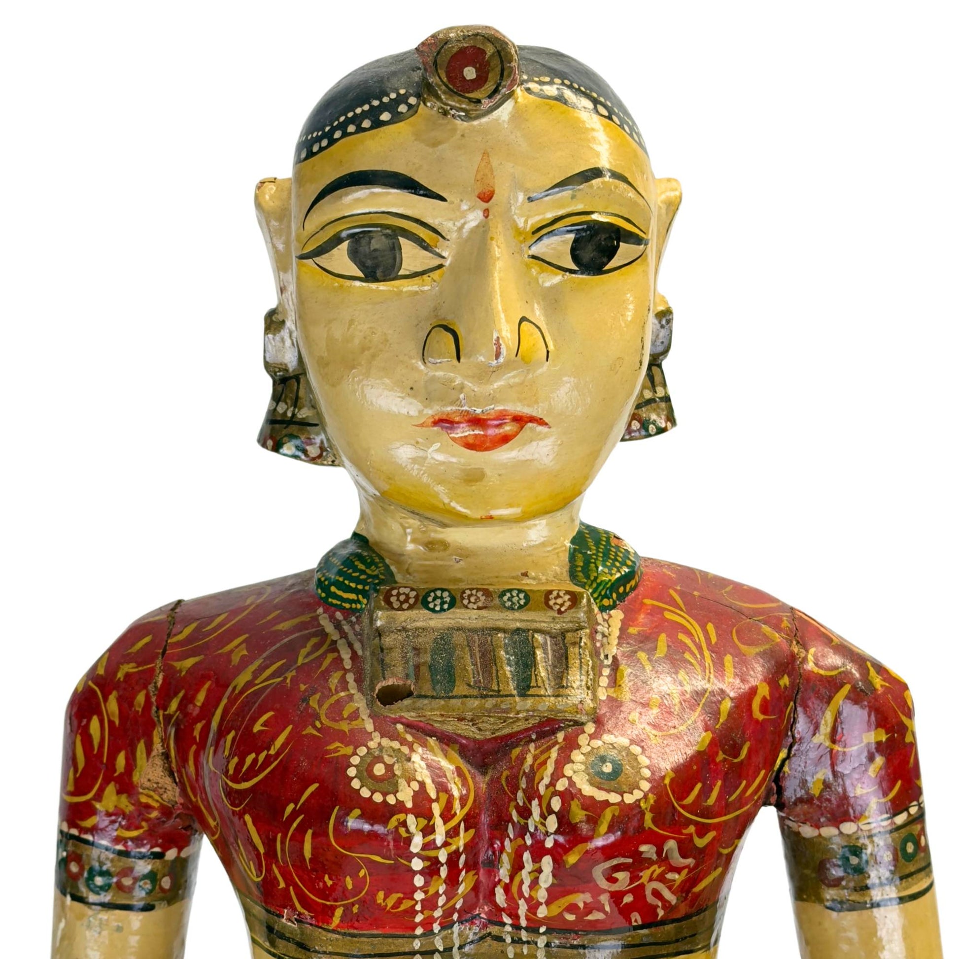Wooden Indian statue on an octagonal base with traditional mortise and tenon joints and visible signs of use.