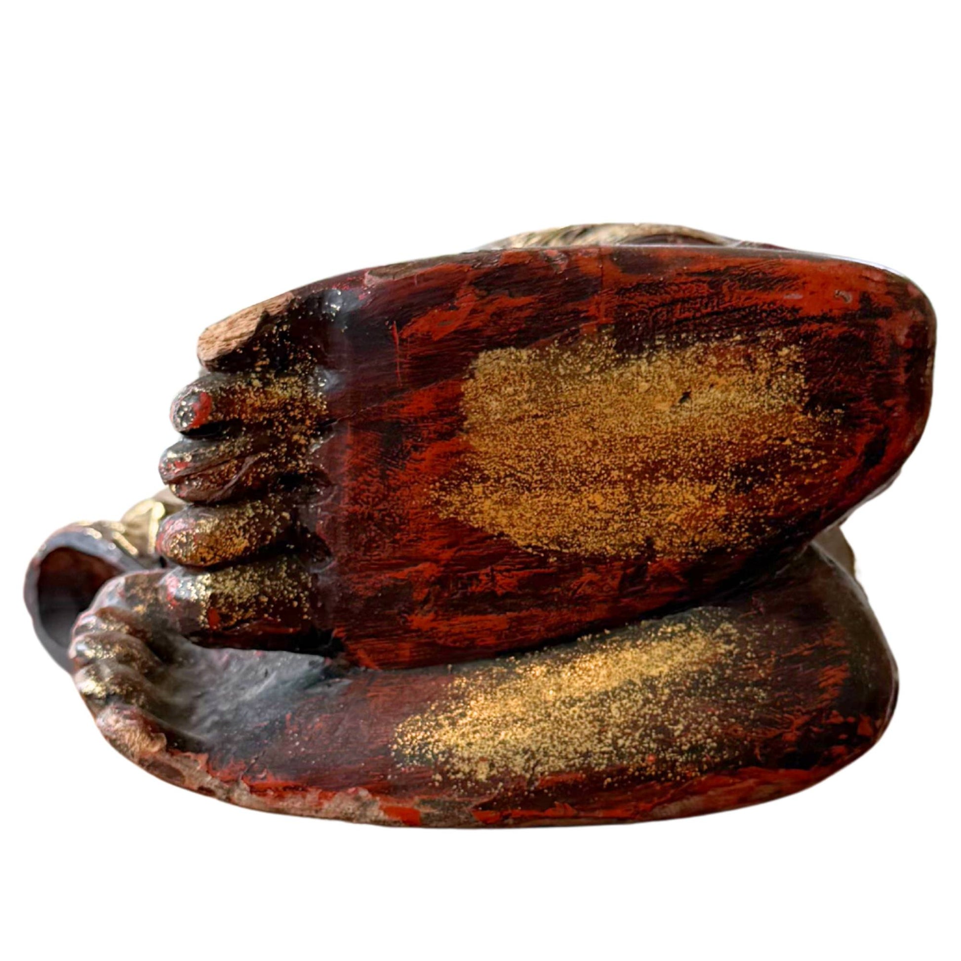 Detail of the hand-carved wooden feet and cushions of the Burmese Tuesday Buddha