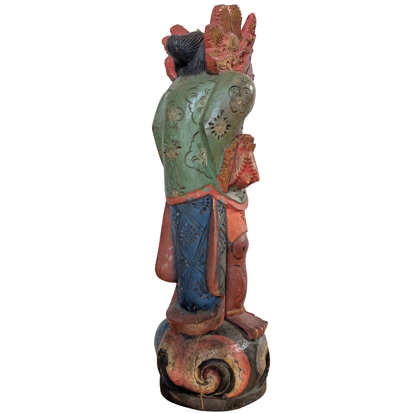 Close-up of the wooden base and the bottom of the Balinese carving