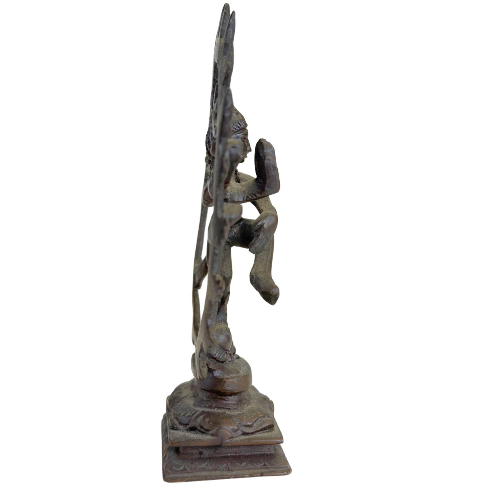 Indian bronze Shiva figurine with traditional flame halo and dancing pose