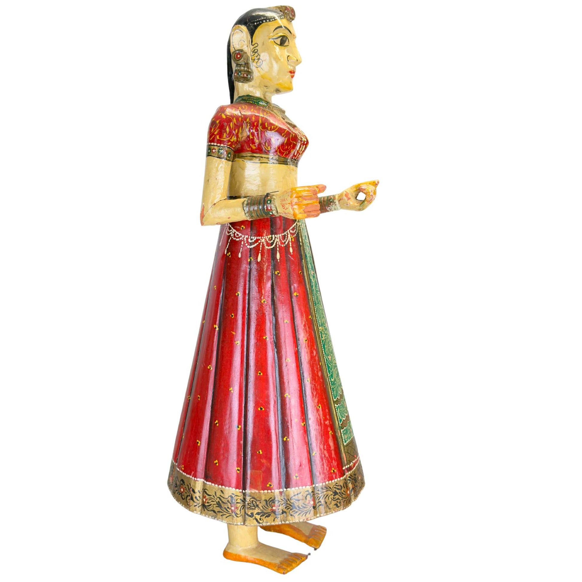 Indian wooden female statue from Rajasthan with large almond-shaped eyes and colorful polychrome painting