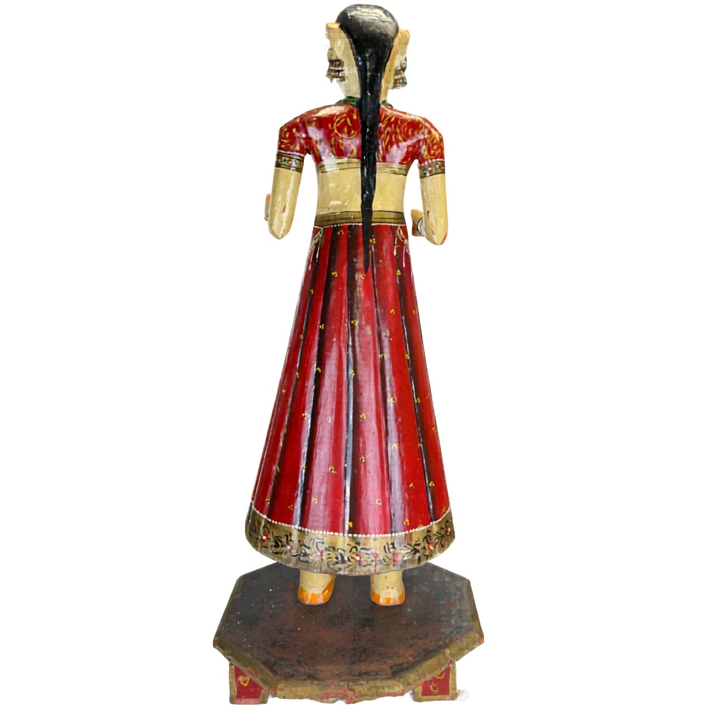 Indian bride as a wooden statue with painted jewelry, bracelets, and a traditional bridal appearance