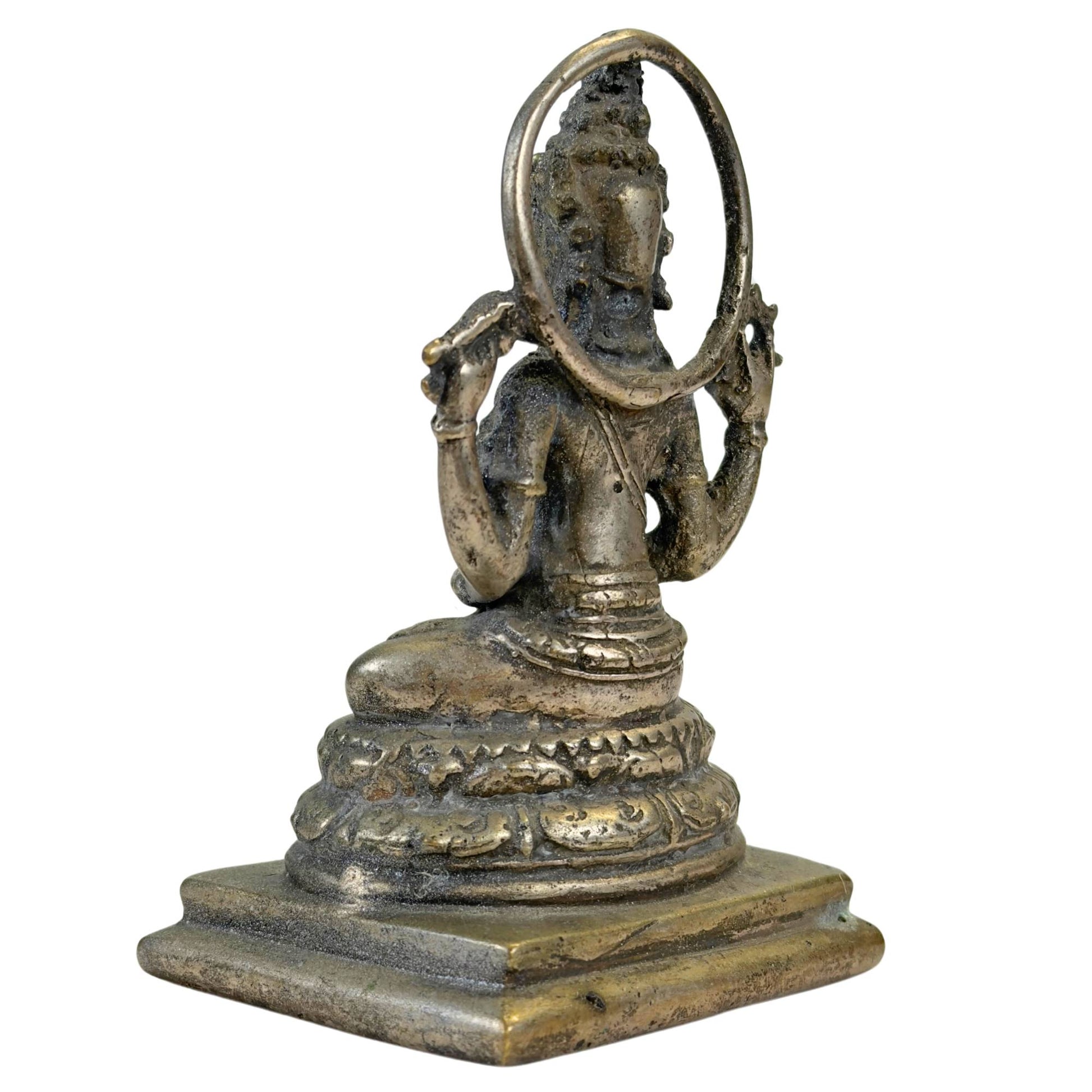 Indonesian bronze statue in Majapahit style with halo, lotus throne, and compact solid casting