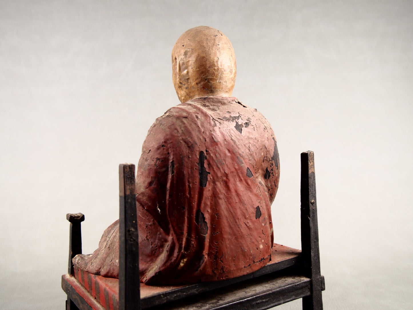 Wooden temple statue of a Buddhist monk

