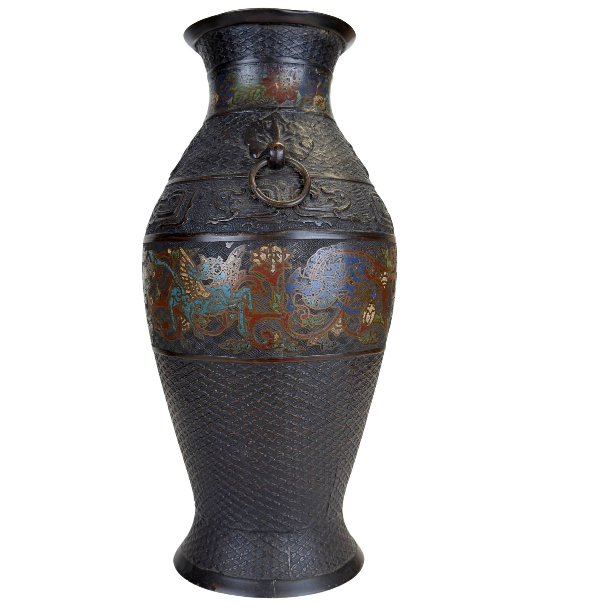 Detail of Japanese champlevé vase with blue mythical creature, floral enamel decoration and fine geometric pattern in the bronze