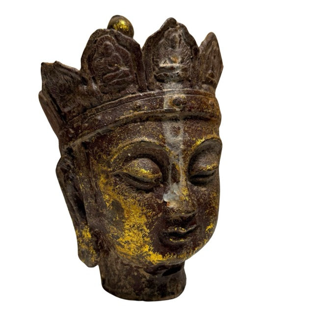 Detail of crown and face of Ksitigarbha Dizang Pusa head with remnants of gold leaf