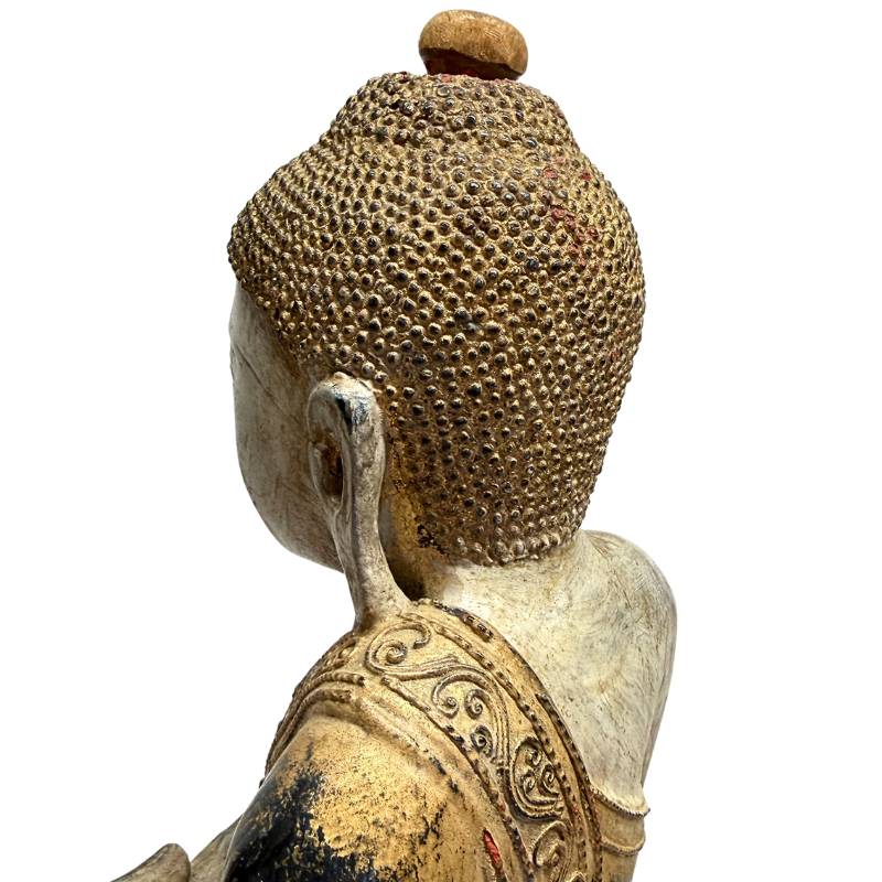 Detail of lacquer and gold layers on a Burmese Buddha statue