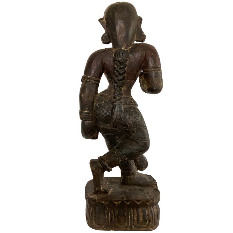 Wooden Lakshmi statue from Nepal with typical Newar carving lines and powerful form
