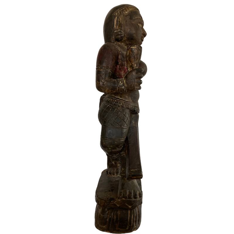 Bottom of Lakshmi statue Nepal made from a single block of wood with visible chisel marks