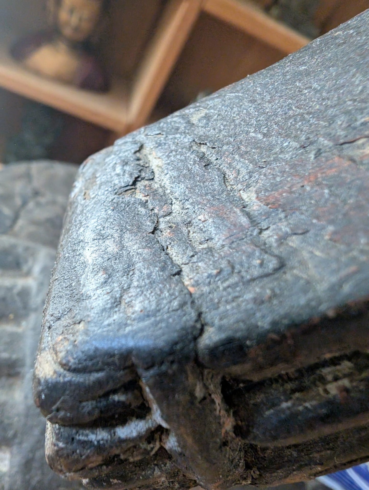 Detail of Lakshmi sculpture from Nepal in wood with paint residue and authentic wear