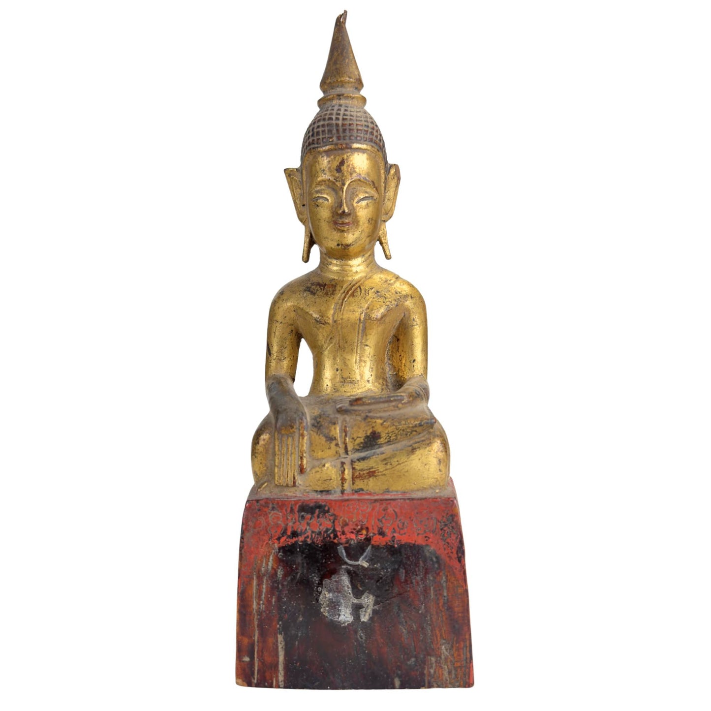 Hand-carved Lanna Buddha made of teak with traces of red lacquer and weathered gold leaf from Northern Thailand