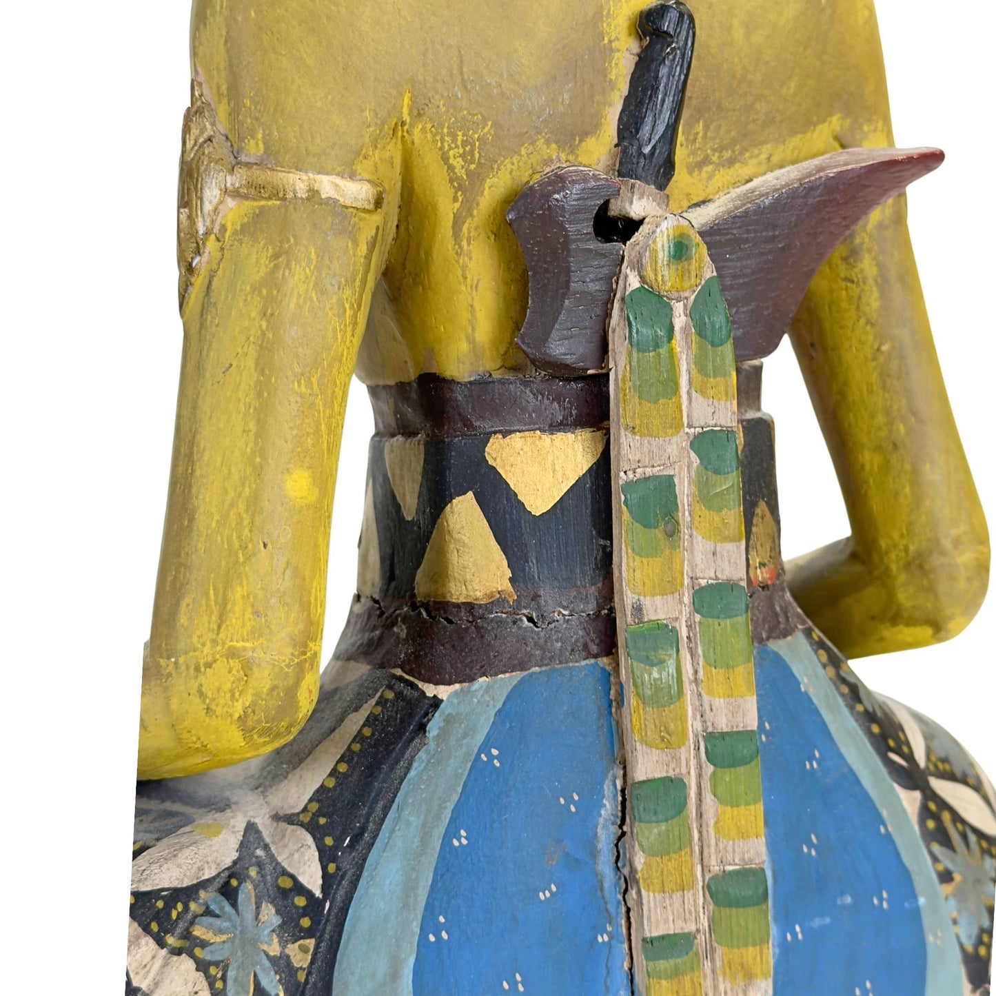 Profile of the female figure with a focus on the graceful sitting posture.
