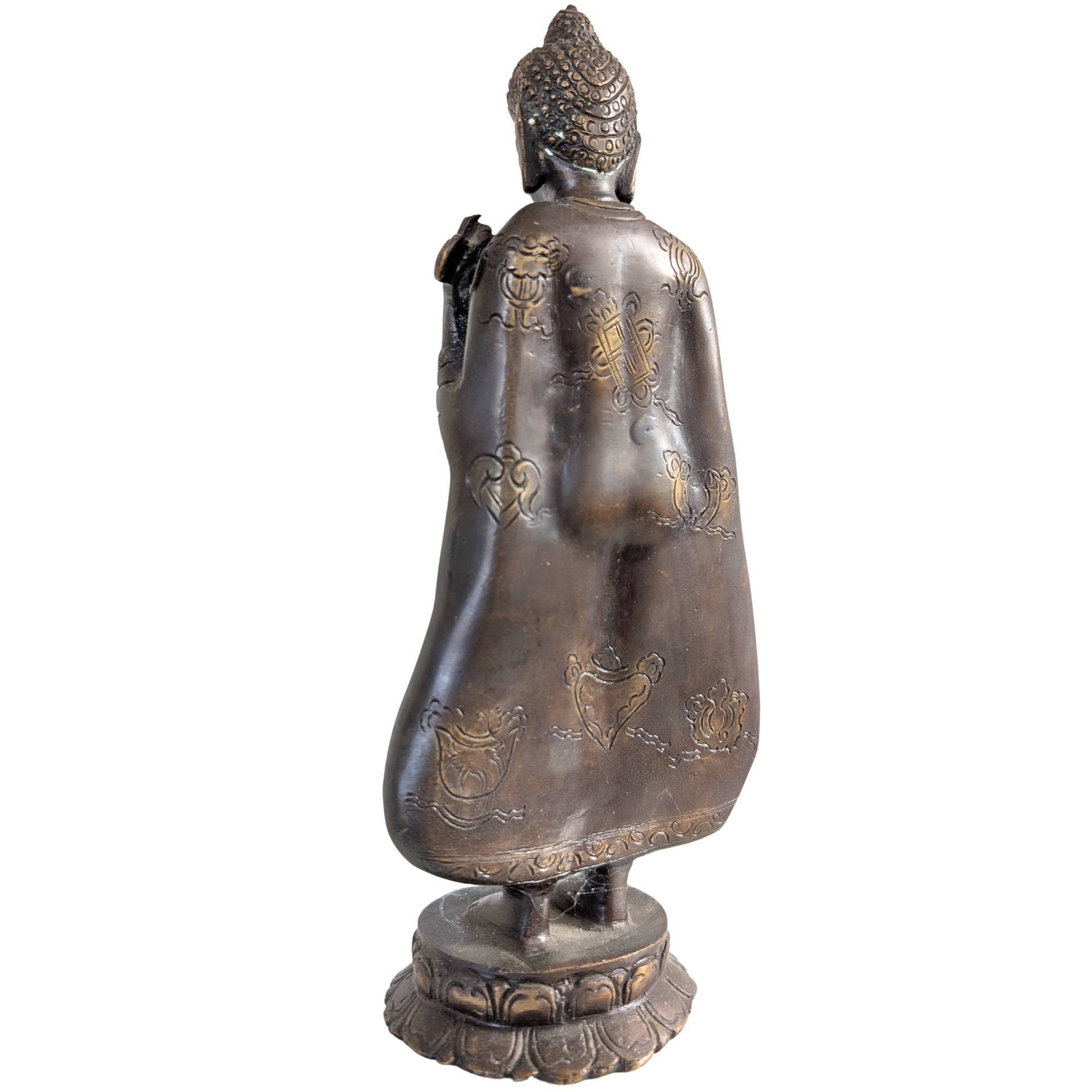 The Buddha standing on a traditional double lotus base of solid bronze.
