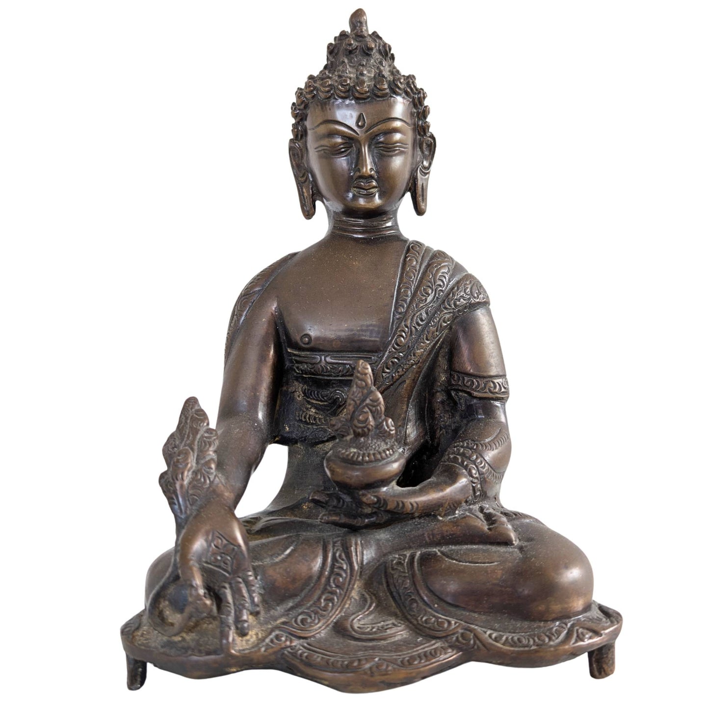 Front view of a 23 cm high solid bronze Medicine Buddha statue from Nepal.