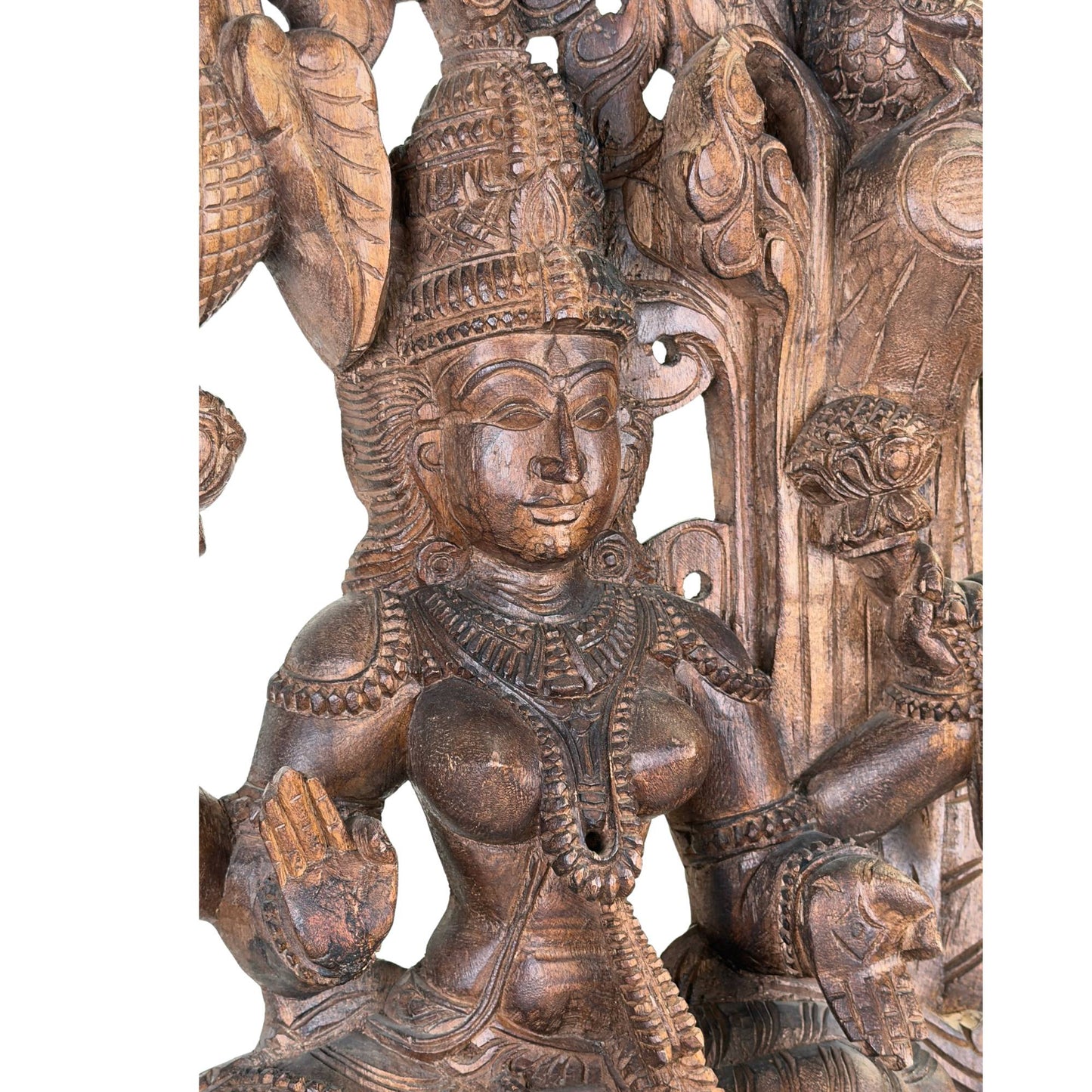 Detail of the hand-carved parrot on the wooden wall panel of the goddess Meenakshi
