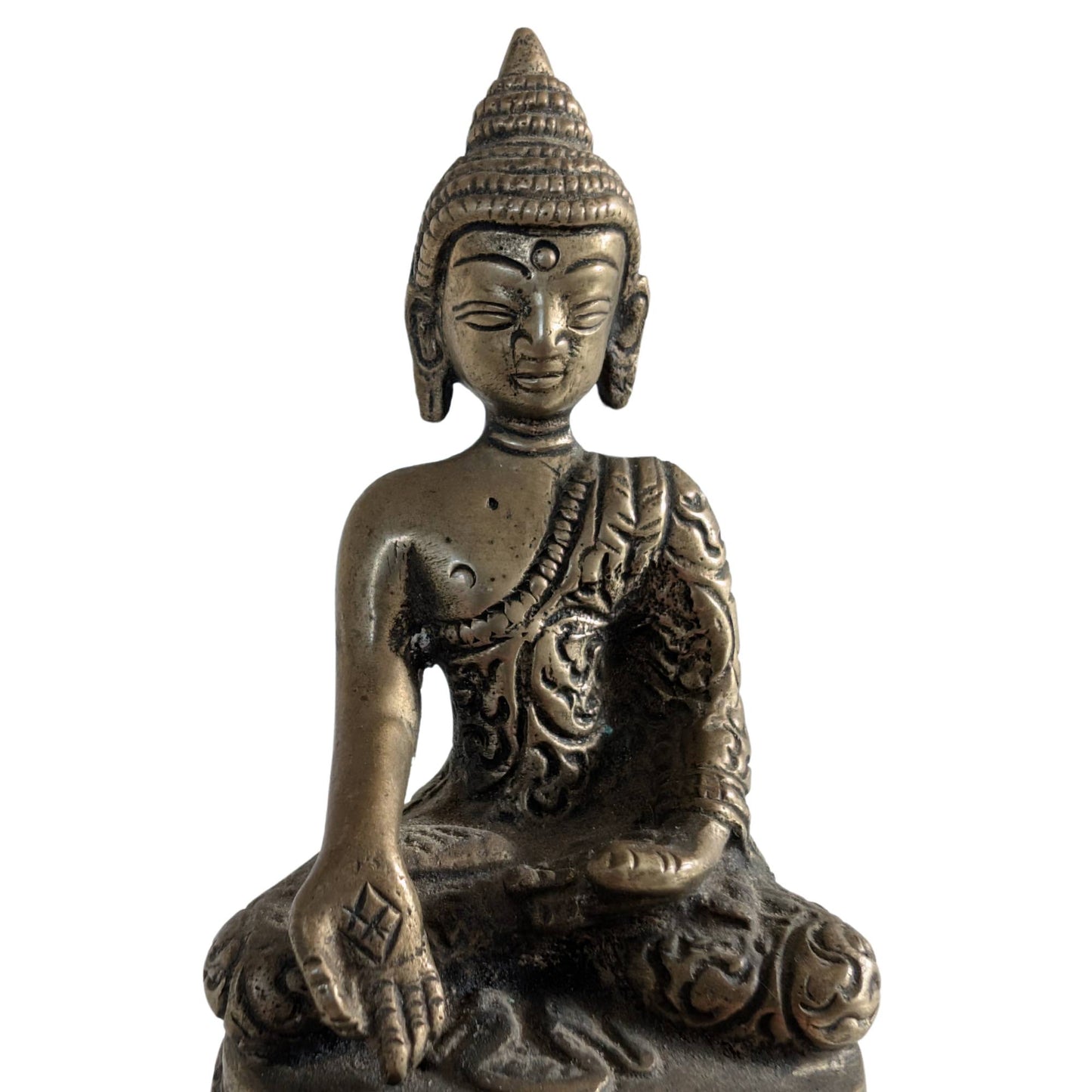 Close-up of the refined details on the 10cm tall brass figurine.