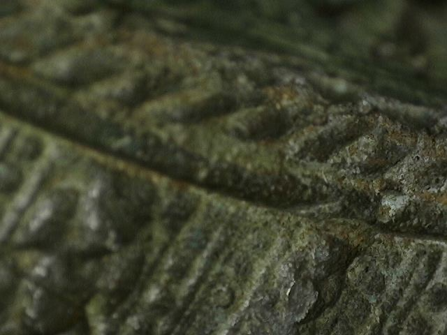 Microscope close-up of oxidation on Thai bronze sculpture