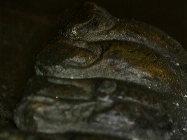 Microscope photo of oxidation layers on an old Thai bronze statue