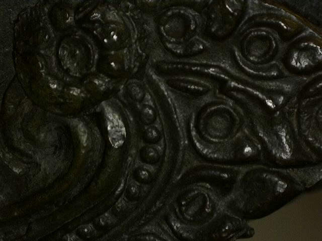 Microscope image of casting detail on antique Thai bronze statue