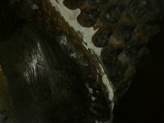 Microscope image of corrosion pattern on ancient Thai bronze sculpture
