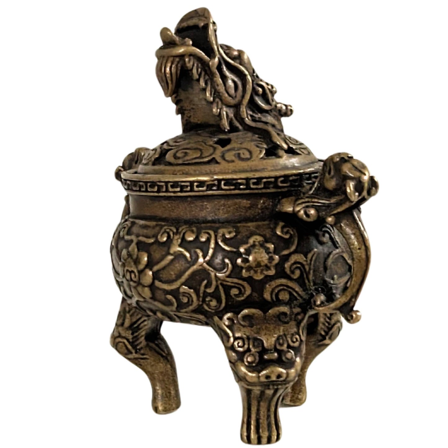 Classic Chinese miniature incense burner with dragon motif on a white background.