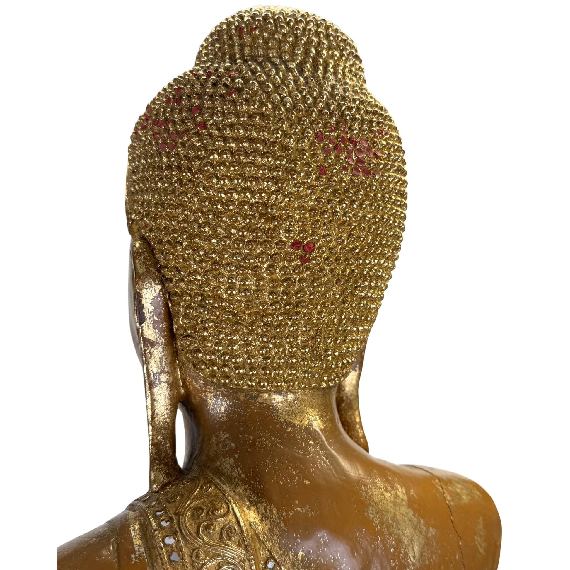 Monumental Burmese Buddha in side profile with gold lacquer, antique polychromy, and richly decorated throne rim and back of the head