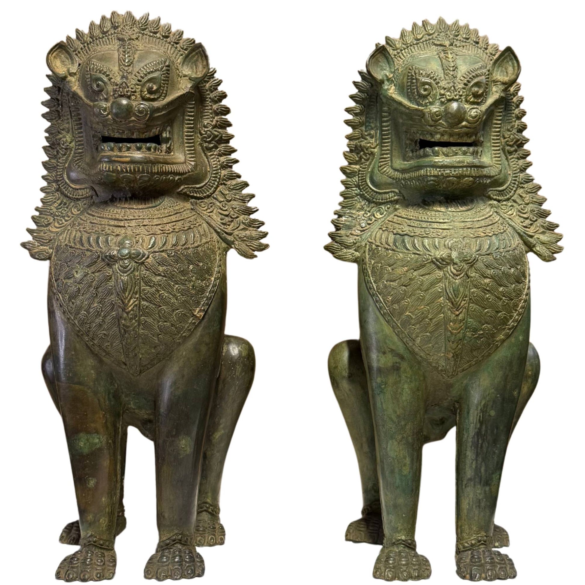 Pair of monumental Singha temple lions of very old bronze for house protection