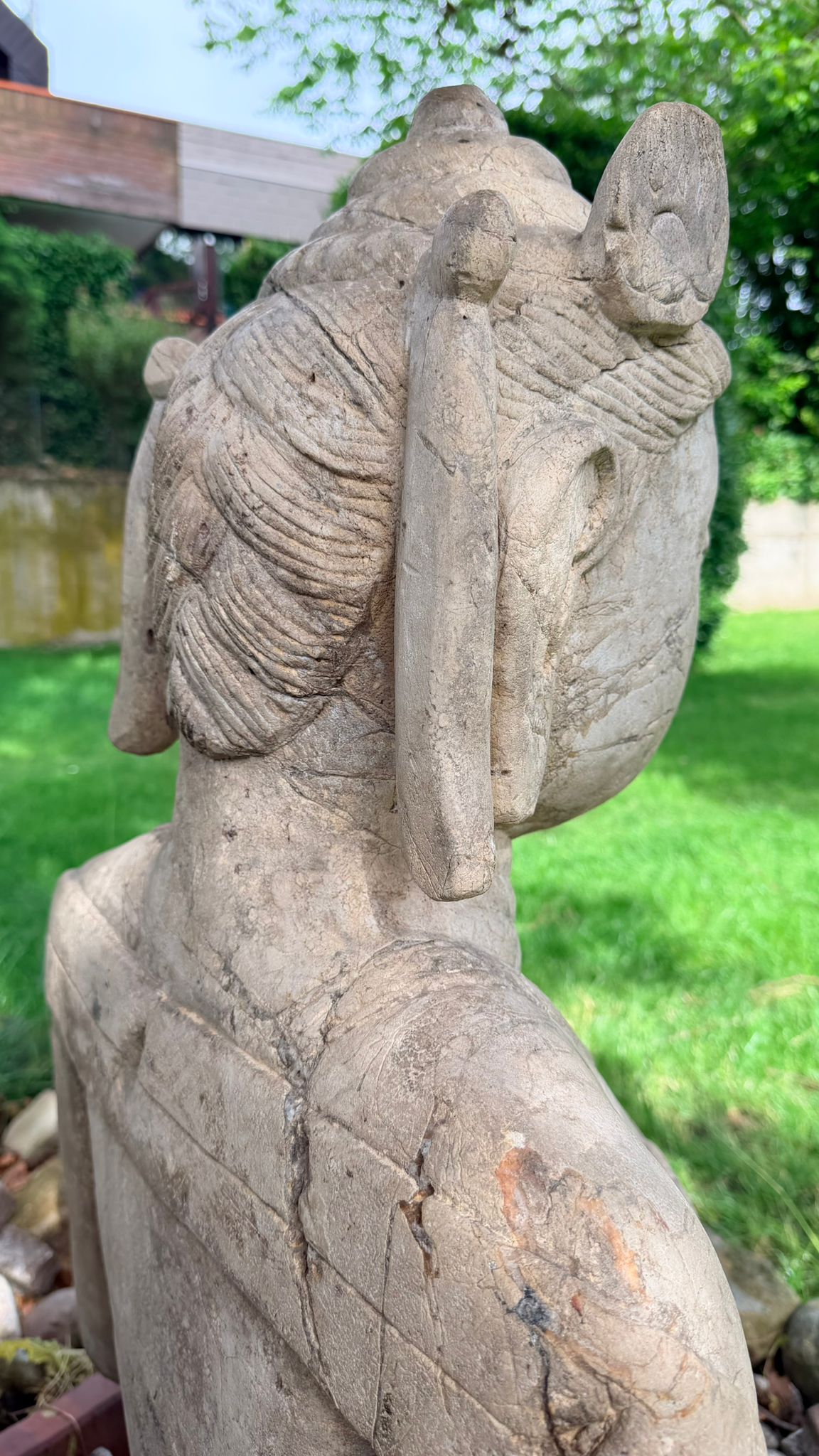 Monumental Indonesian temple figure with centuries-old stone structure