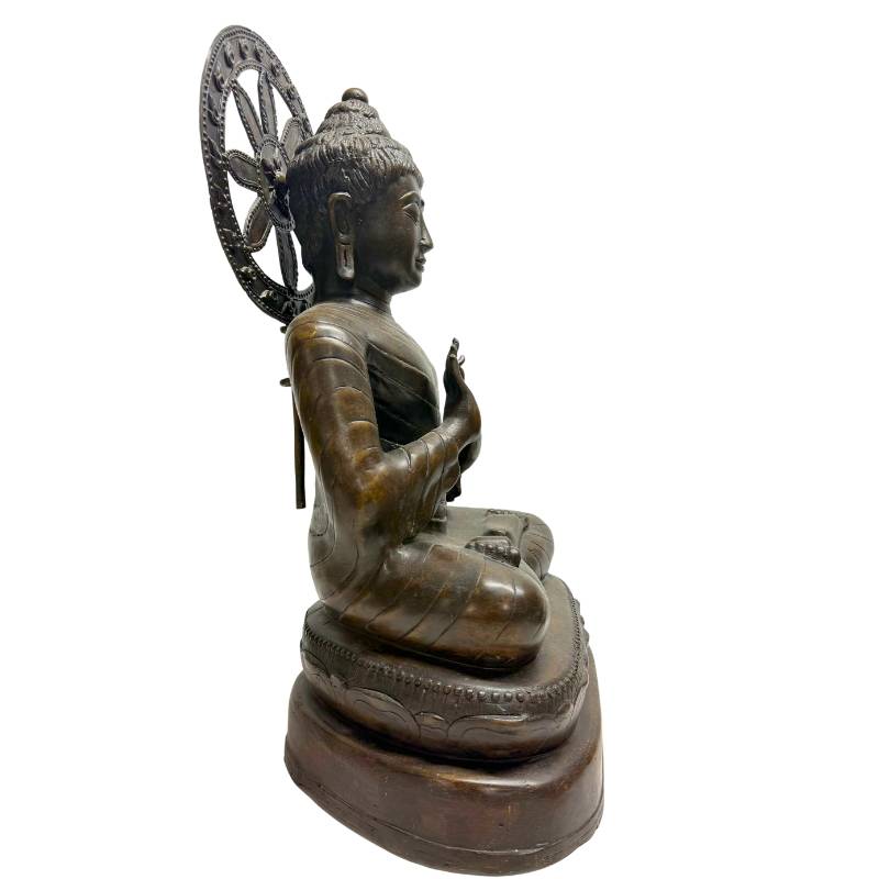 Myanmar Buddha Dharma Chakra Mudra bronze statue face detail mandalay style calm expression