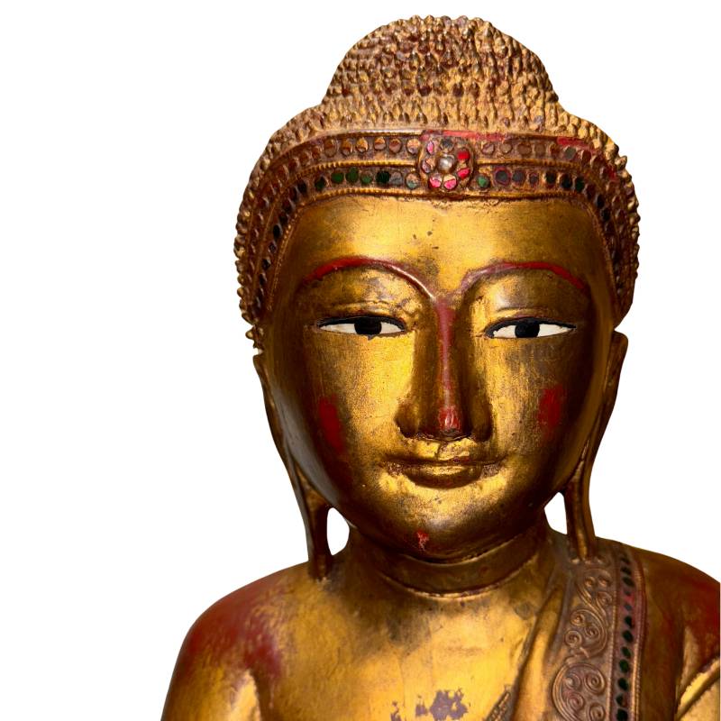 Myanmar devotional statue made of wood with gilded finish and antique character